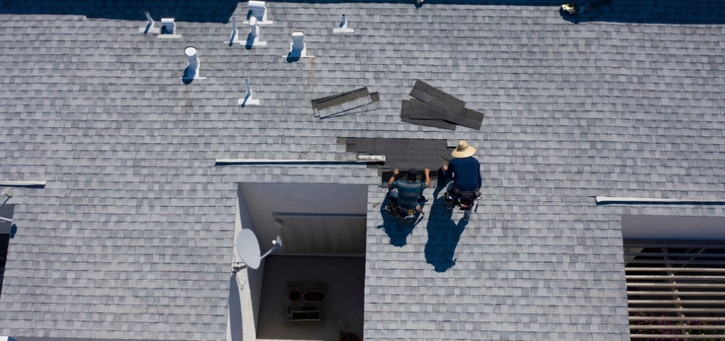 Roofing contractors in Connecticut, specializing in commercial asphalt roof replacement services and cost estimates.
