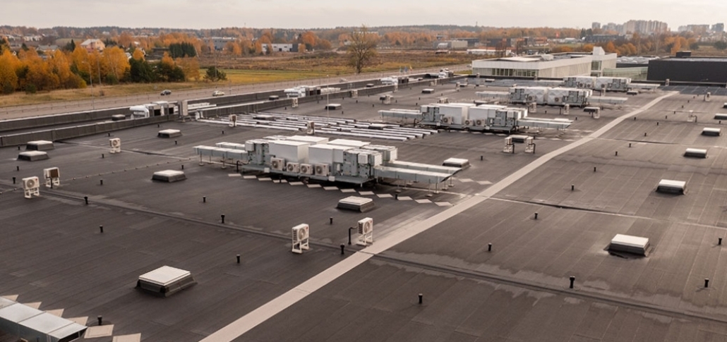 A large roof featuring multiple substantial buildings, illustrating built-up roofing as a commercial roofing option.