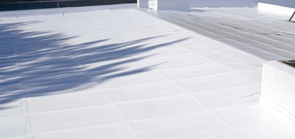 A roof featuring a white plastic covering, representing a choice in commercial roofing materials like EPDM.