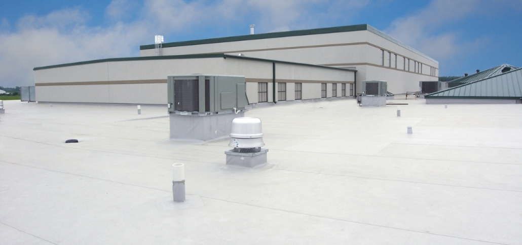 A large industrial building featuring a roof equipped with air conditioning units, relevant for solar panel suitability assessment.