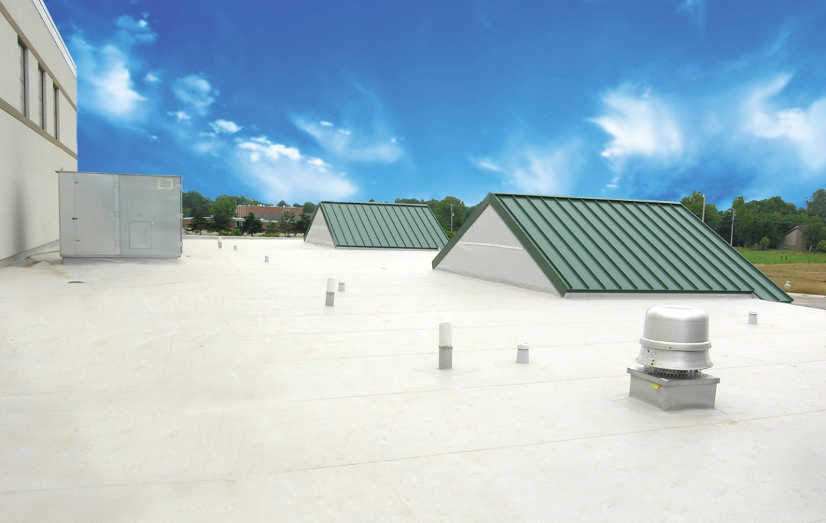 A commercial roof with green metal and Duro-Last roofing, highlighting a recent installation in Connecticut.
