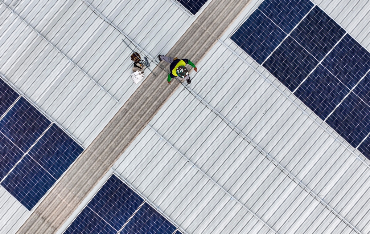 Aerial perspective of solar panels on a roof, highlighting commercial solar energy use in Stratford, CT.