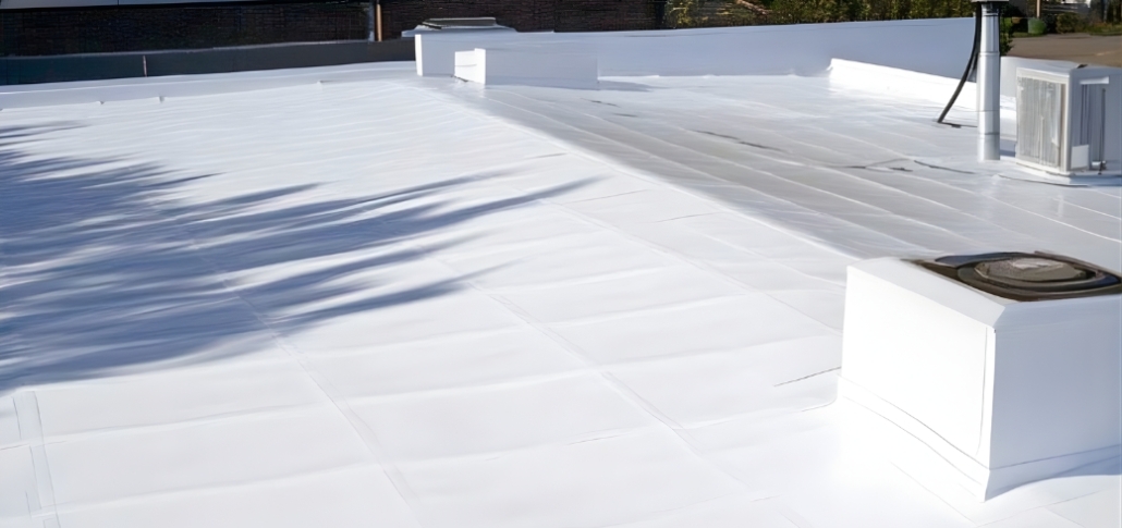 A roof featuring a white plastic covering, representing a choice in commercial roofs for industrial buildings like EPDM.